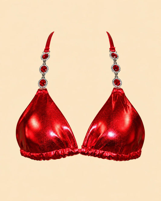 ruby bikini top with jeweled straps on sandy portrait background